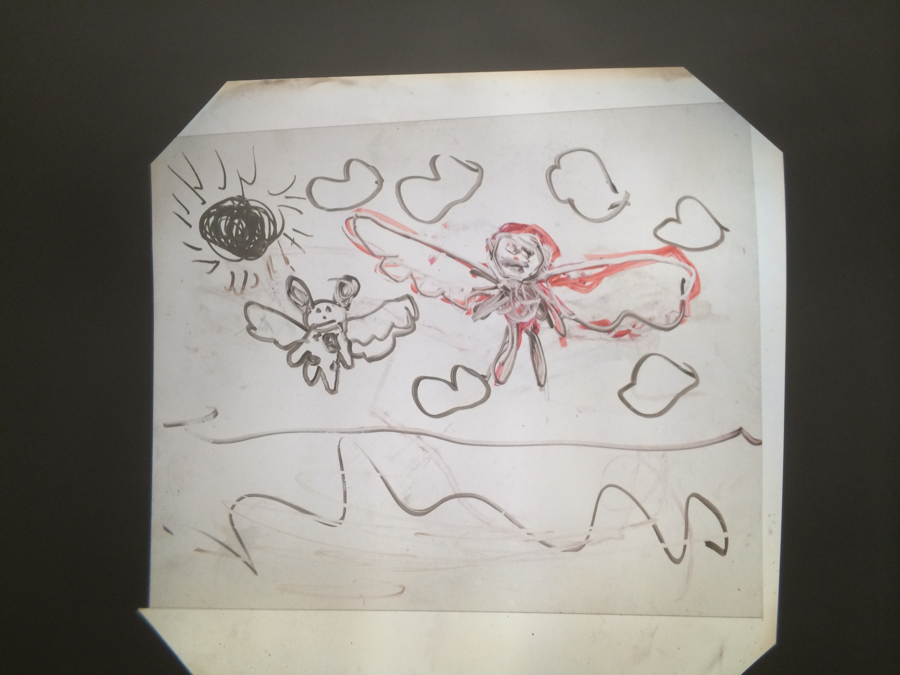 picture show sister flying over ocean with stuffed dog